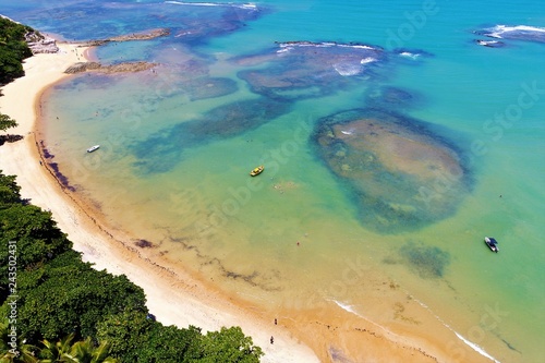 Aerial view of a paradise beach with crystal water. Fantastic landscape. Great beach view. Trancoso, Bahia, Brazil photo
