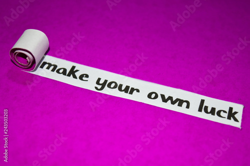Make your own luck text, Inspiration, Motivation and business concept on purple torn paper