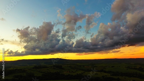 Aerial view of a sunset with sunbeams from forest. Countryside view. Fantastic landscape. Great colors and contrast