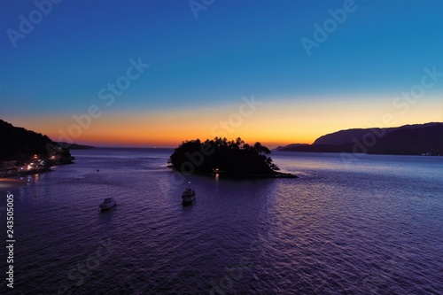 Aerial view of sunset on the beach. Great sunset view. Fantastic landscape. Great colors and contrast. Ilhabela, Brazil