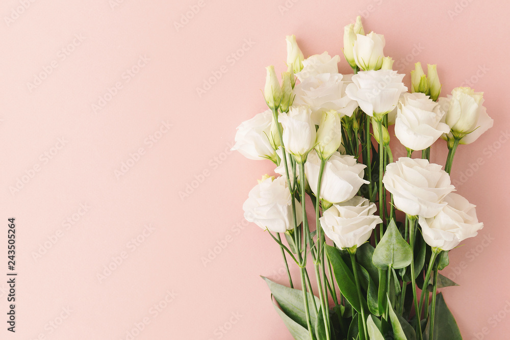 Bouquet of white roses on pink