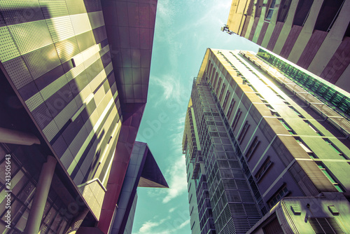 Looking up on a large building or city Media business and investment