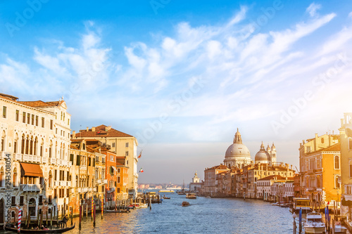 Grand Canal in Venice, Italy. Beautiful picturesque clouds in the sky. Basilica di Santa Maria della Salute