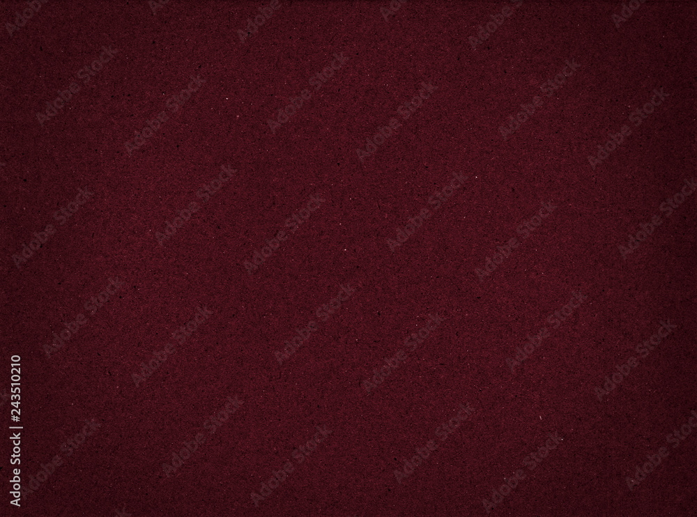 Fototapeta premium Texture of cardboard closeup, dark red abstract paper background.