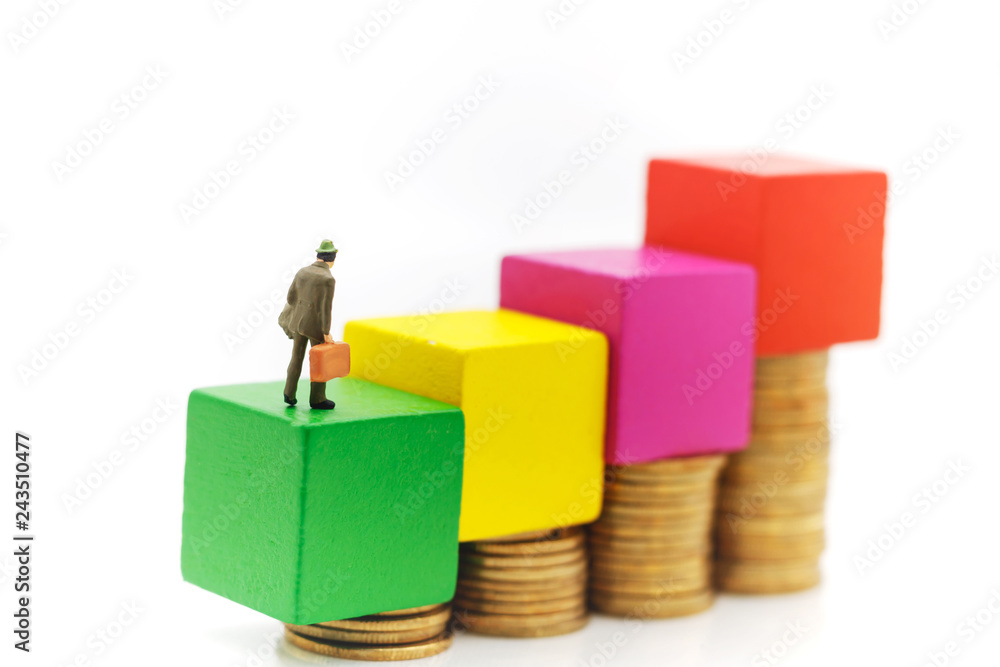 Miniature people: Businessmen standing with coins stack, Finance, investment and growth in business concept. Miniature people: Businessmen standing with coins stack, Finance, investment and growth in business concept.