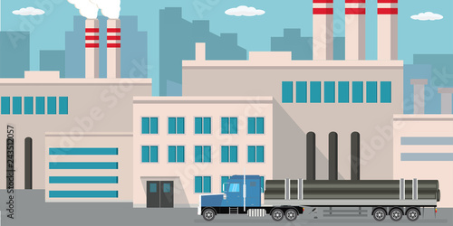 Industrial factory and long truck  with metal pipes.
