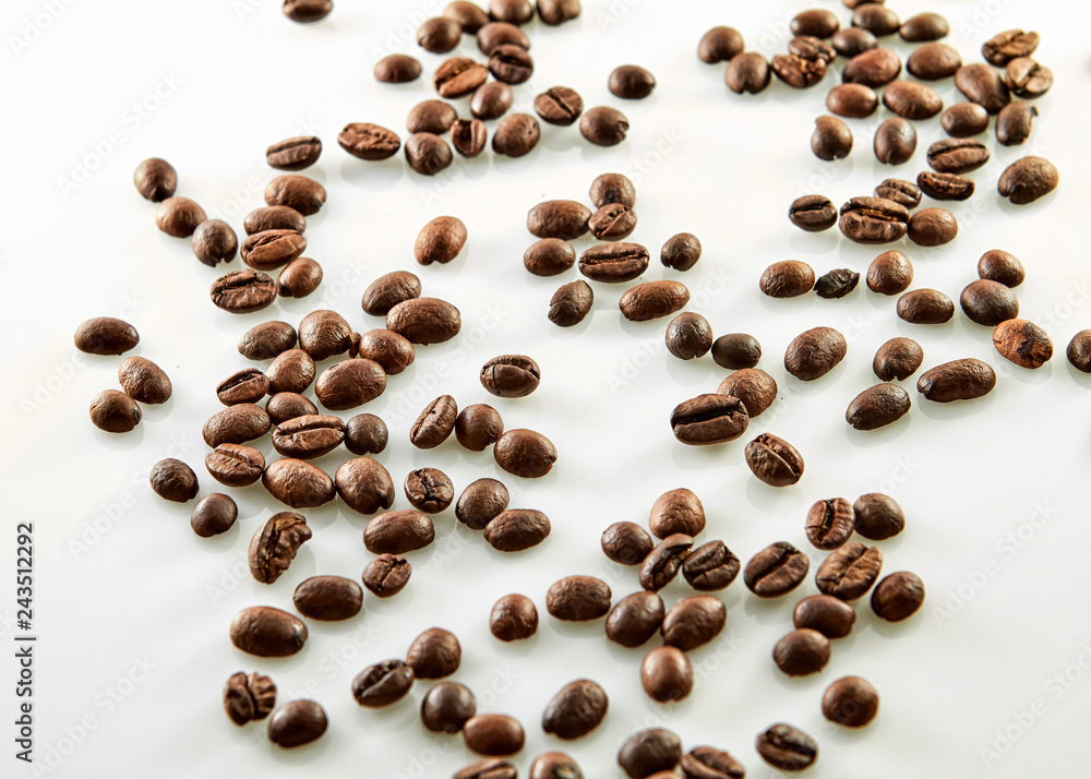 Coffee beans scattered isolated on white background Coffee beans scattered isolated on white background