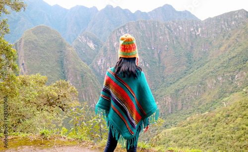 Female traveler being impressed with the breathtaking view of mountain range seen from Huayna Picchu mountain, Cusco Region, Peru