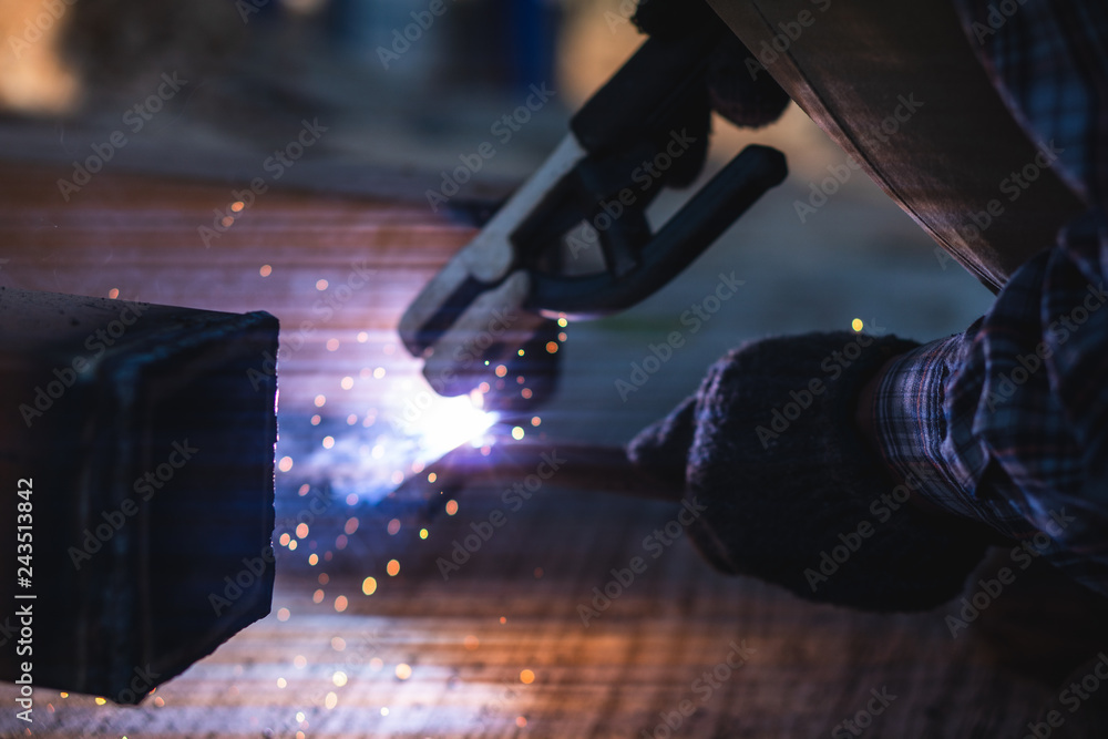 The technician is using the welding tool in the construction work. The technician is using the welding tool in the construction work.