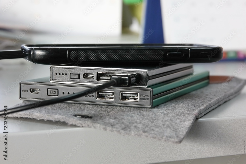 black smart phone is charging power from supply battery black smart phone is charging power from supply battery