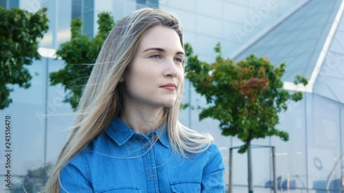 Pretty girl with beautiful blue eyes and long hair closeup portrait