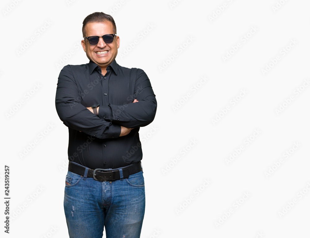 Middle age arab man wearing sunglasses over isolated background happy face smiling with crossed arms looking at the camera. Positive person. Middle age arab man wearing sunglasses over isolated background happy face smiling with crossed arms looking at the camera. Positive person.
