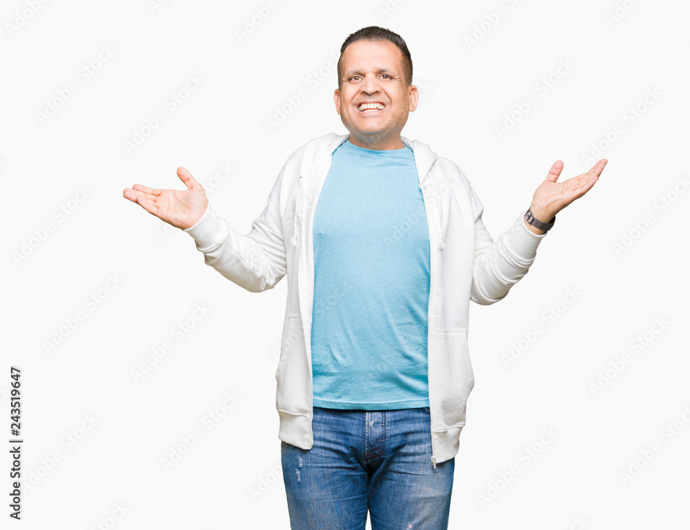 Middle age arab man wearing sweatshirt over isolated background Smiling showing both hands open palms, presenting and advertising comparison and balance Middle age arab man wearing sweatshirt over isolated background Smiling showing both hands open palms, presenting and advertising comparison and balance