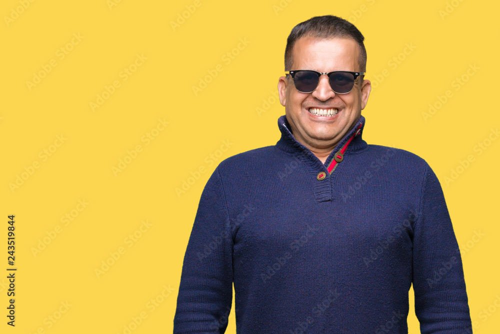 Middle age arab man wearing sunglasses over isolated background with a happy and cool smile on face. Lucky person. Middle age arab man wearing sunglasses over isolated background with a happy and cool smile on face. Lucky person.