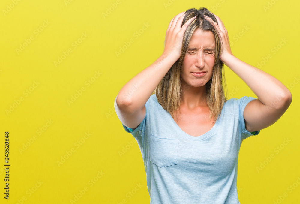 Young beautiful woman over isolated background suffering from headache desperate and stressed because pain and migraine. Hands on head. Young beautiful woman over isolated background suffering from headache desperate and stressed because pain and migraine. Hands on head.