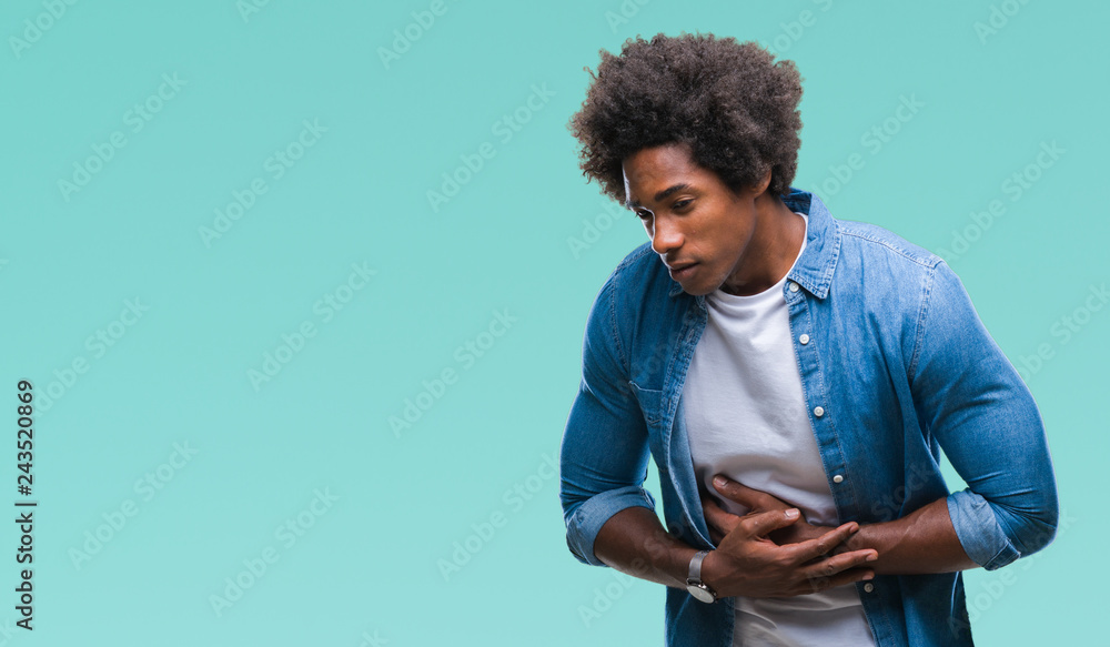 Afro american man over isolated background with hand on stomach because indigestion, painful illness feeling unwell. Ache concept. Afro american man over isolated background with hand on stomach because indigestion, painful illness feeling unwell. Ache concept.