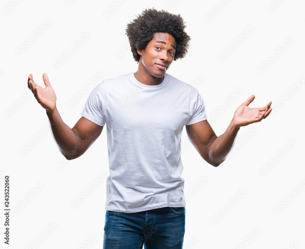 Afro american man over isolated background clueless and confused expression with arms and hands raised. Doubt concept. Afro american man over isolated background clueless and confused expression with arms and hands raised. Doubt concept.