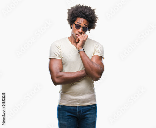 Afro american man wearing sunglasses over isolated background thinking looking tired and bored with depression problems with crossed arms.