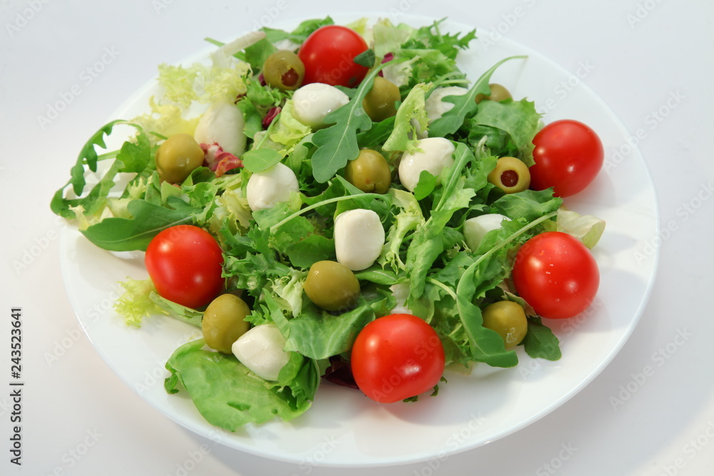 fresh vegetable salad with tomatoes and mozzarella