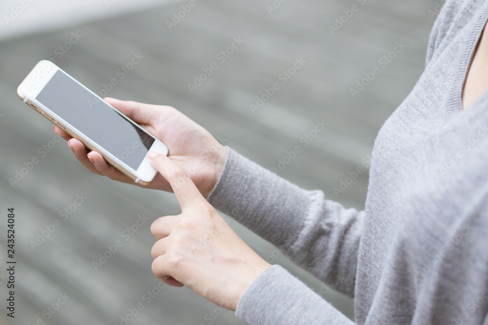 Lifestyle  close up hand young woman in watching message on mobile smart phone during break. using cell phones to communicate in the online world. with blank or empty black screen 