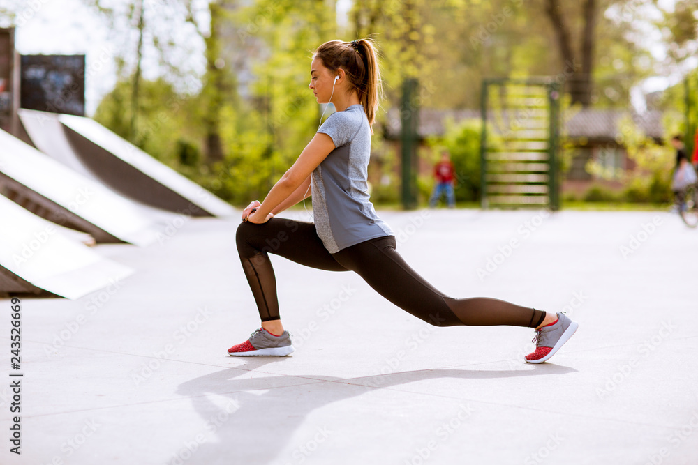 Fototapeta premium Pretty young woman stretching