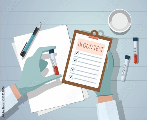 Hands a medical doctor holding blood sample and making notes. Workplace.  