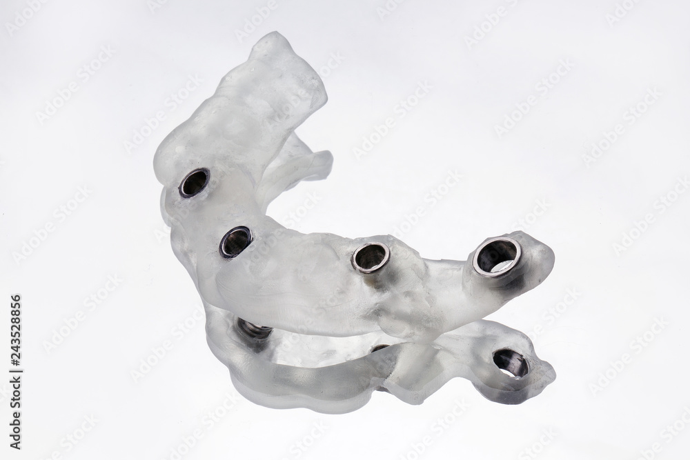 Naklejka premium Photo quality surgical template on six implants removed on a mirror with white background