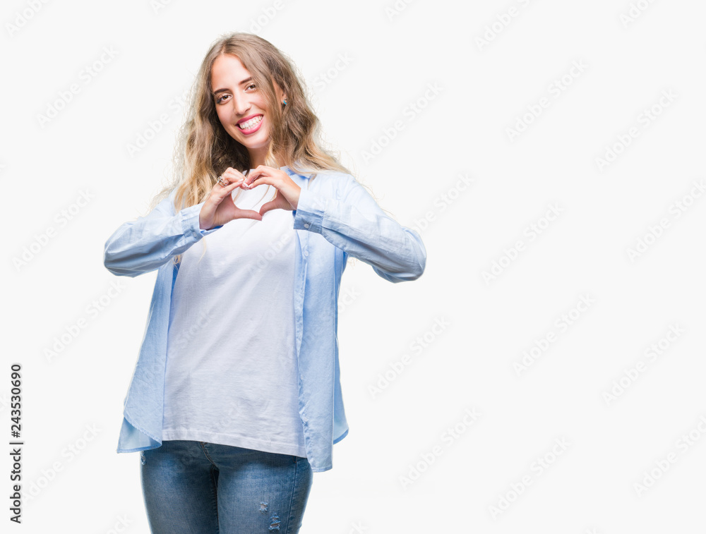Beautiful young blonde woman over isolated background smiling in love showing heart symbol and shape with hands. Romantic concept. Beautiful young blonde woman over isolated background smiling in love showing heart symbol and shape with hands. Romantic concept.