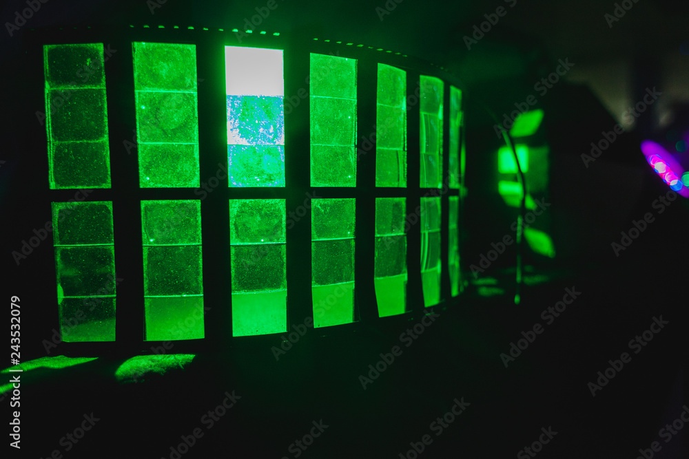 a green floodlight on a disco a green floodlight on a disco