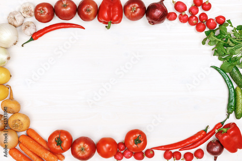 Vegetables and fruits on a white wooden table. Top view. Copy space.