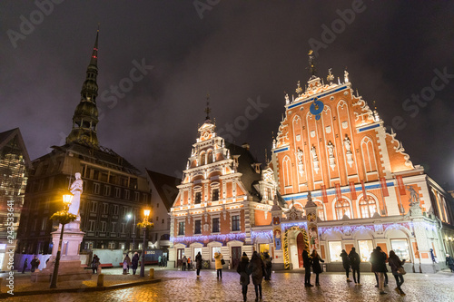 City Hall Square with House of the Blackheads and Saint Peter church in Old Town of Riga at night during Christmas, Latvia