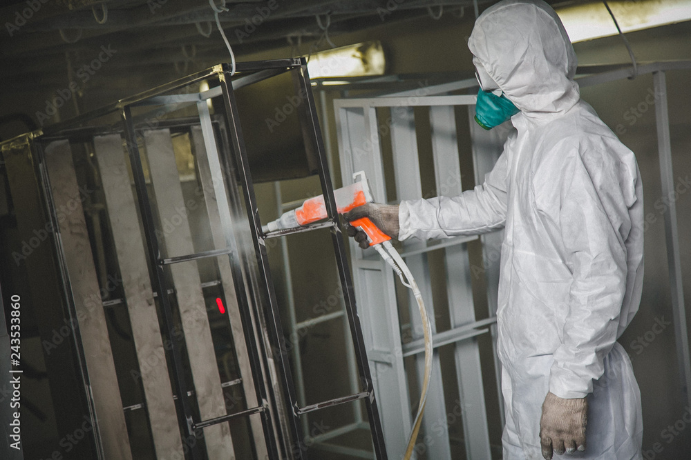 at the factory painting spray gun, Painter working with airbrush at the factory painting spray gun, Painter working with airbrush