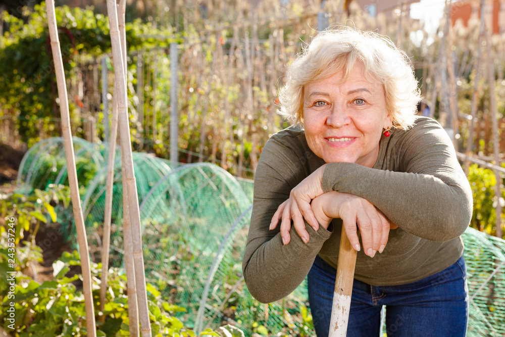 Fototapeta premium Portrait of woman among plants