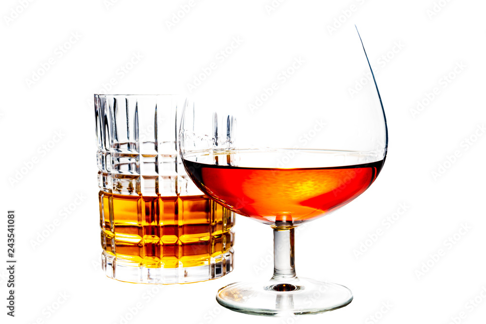 Brandy and Whiskey glasses isolated on a white background Brandy and Whiskey glasses isolated on a white background