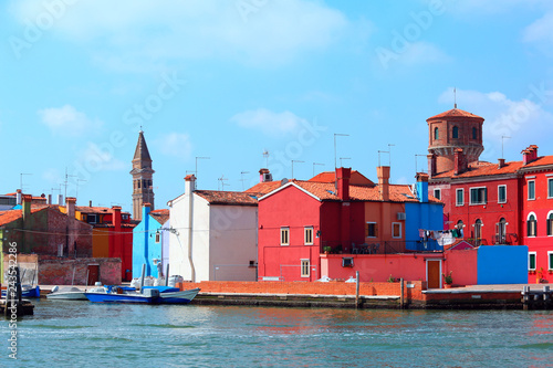 colored houses and old bell tower in the island of Burano near Venice in Italy