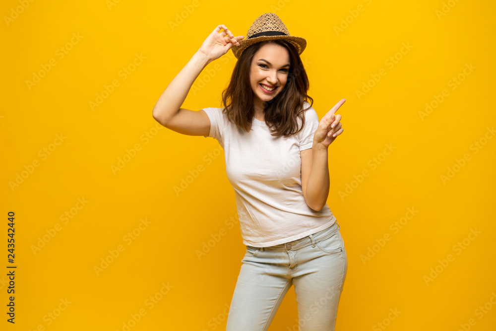 No way, look this ! Woman pointing finger at copy space. Expression emotion and feelings concept. Studio shot, isolated on yellow background. No way, look this ! Woman pointing finger at copy space. Expression emotion and feelings concept. Studio shot, isolated on yellow background.
