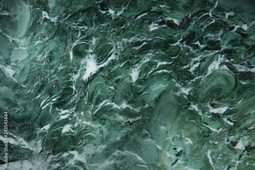 Awesome background of green natural stone marble with a white pattern, called Verde Venezia