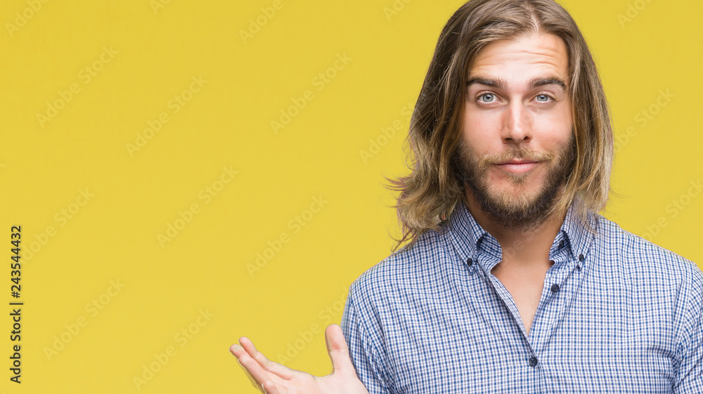 Young handsome man with long hair over isolated background clueless and confused expression with arms and hands raised. Doubt concept. Young handsome man with long hair over isolated background clueless and confused expression with arms and hands raised. Doubt concept.