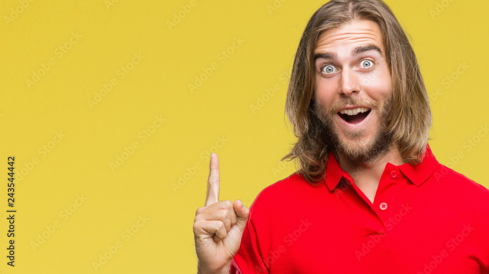 Young handsome man with long hair over isolated background pointing finger up with successful idea. Exited and happy. Number one. Young handsome man with long hair over isolated background pointing finger up with successful idea. Exited and happy. Number one.