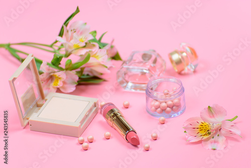 Cosmetics for makeup on pink background