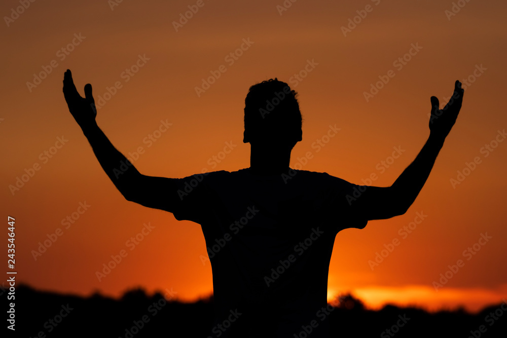 Silhouette of man clamoring to the heavens, sunset background. Silhouette of man clamoring to the heavens, sunset background.