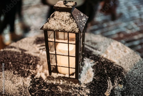 old lantern in snow