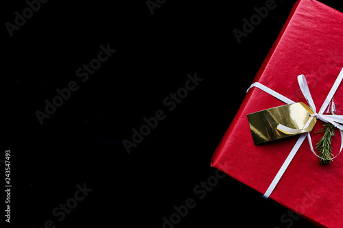 red gift box on black background