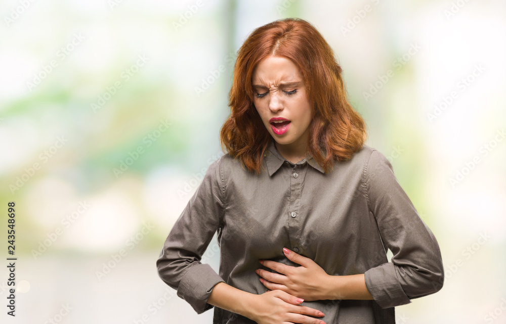 Young beautiful woman over isolated background with hand on stomach because indigestion, painful illness feeling unwell. Ache concept. Young beautiful woman over isolated background with hand on stomach because indigestion, painful illness feeling unwell. Ache concept.