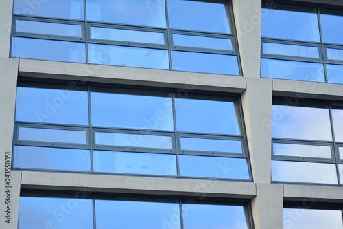 Abstract fragment of modern architecture, walls made of glass and concrete.