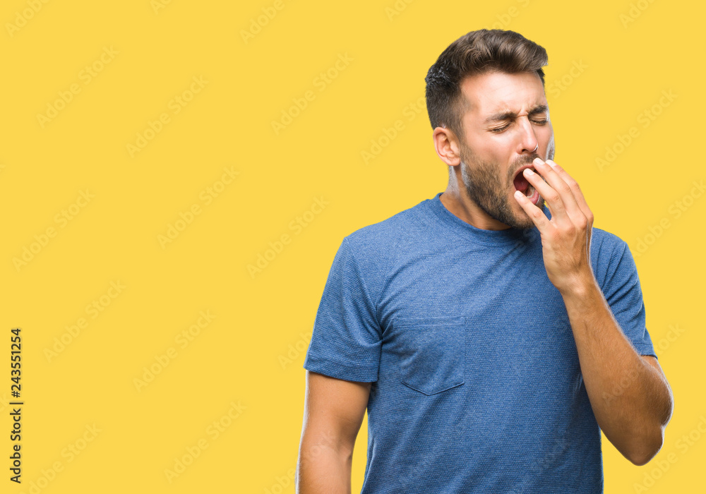 Young handsome man over isolated background bored yawning tired covering mouth with hand. Restless and sleepiness. Young handsome man over isolated background bored yawning tired covering mouth with hand. Restless and sleepiness.