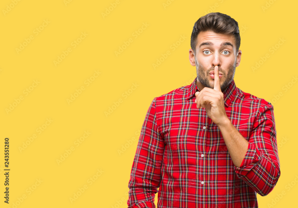 Young handsome man over isolated background asking to be quiet with finger on lips. Silence and secret concept. Young handsome man over isolated background asking to be quiet with finger on lips. Silence and secret concept.