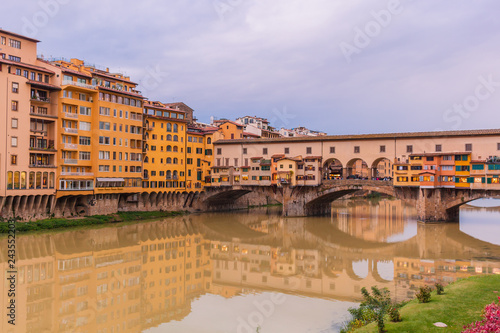 Colorful old buildings on the bank of Arno river in Florence, Italy Ponte Vecchio Bridge. Medieval architecture