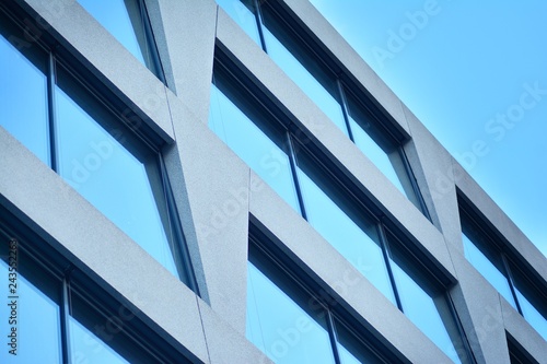 Abstract fragment of modern architecture, walls made of glass and concrete.