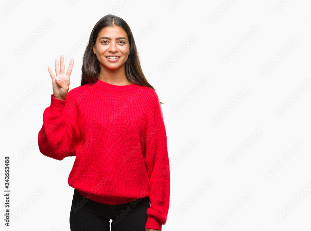 Young beautiful arab woman wearing winter sweater over isolated background showing and pointing up with fingers number four while smiling confident and happy. Young beautiful arab woman wearing winter sweater over isolated background showing and pointing up with fingers number four while smiling confident and happy.